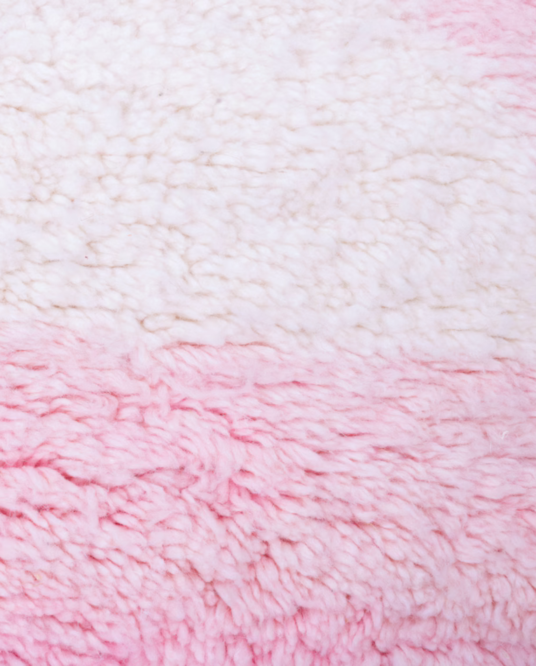 SILYA Azilal pink abstract color block Moroccan rug close-up showing hand-knotted wool texture and pile detail, by NURA