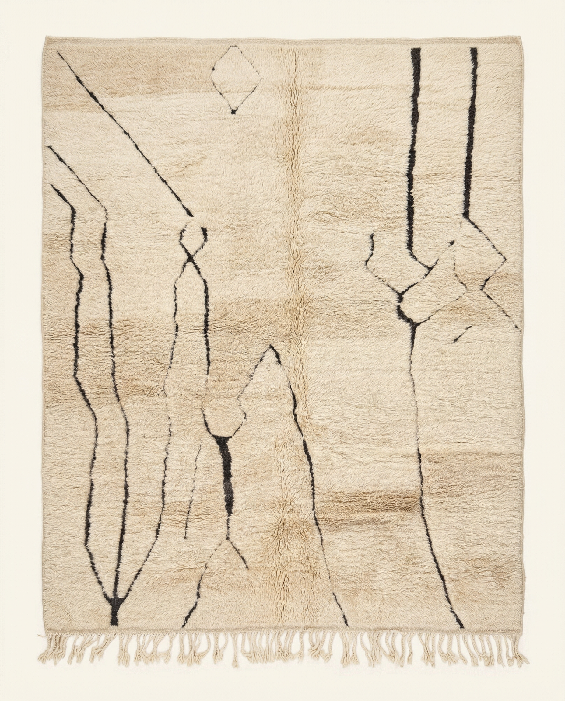 Plush beige Mrirt Moroccan rug with bold charcoal organic abstract lines and a dense high pile, by NURA.