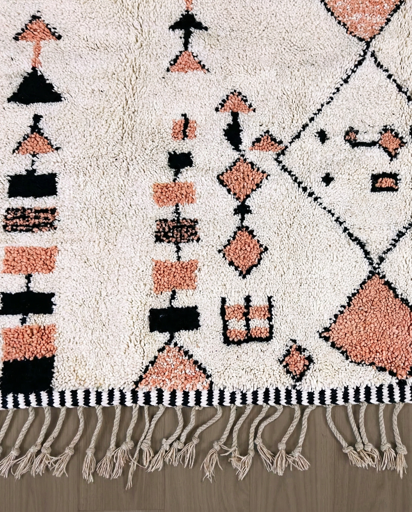 SOUHAILA Azilal cream scattered floating motifs Moroccan rug close-up of hand-tied fringe and kilim band detail, by NURA