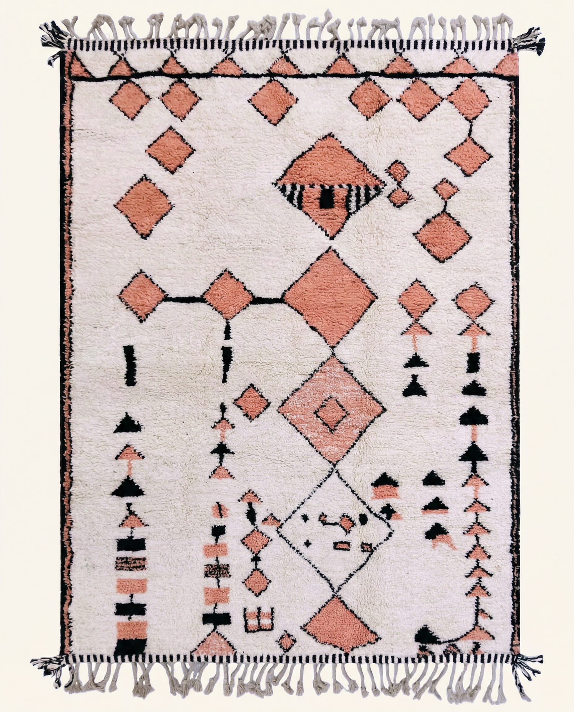 Plush cream Azilal Moroccan rug with scattered peach and black floating motifs and a thick high pile, by NURA.