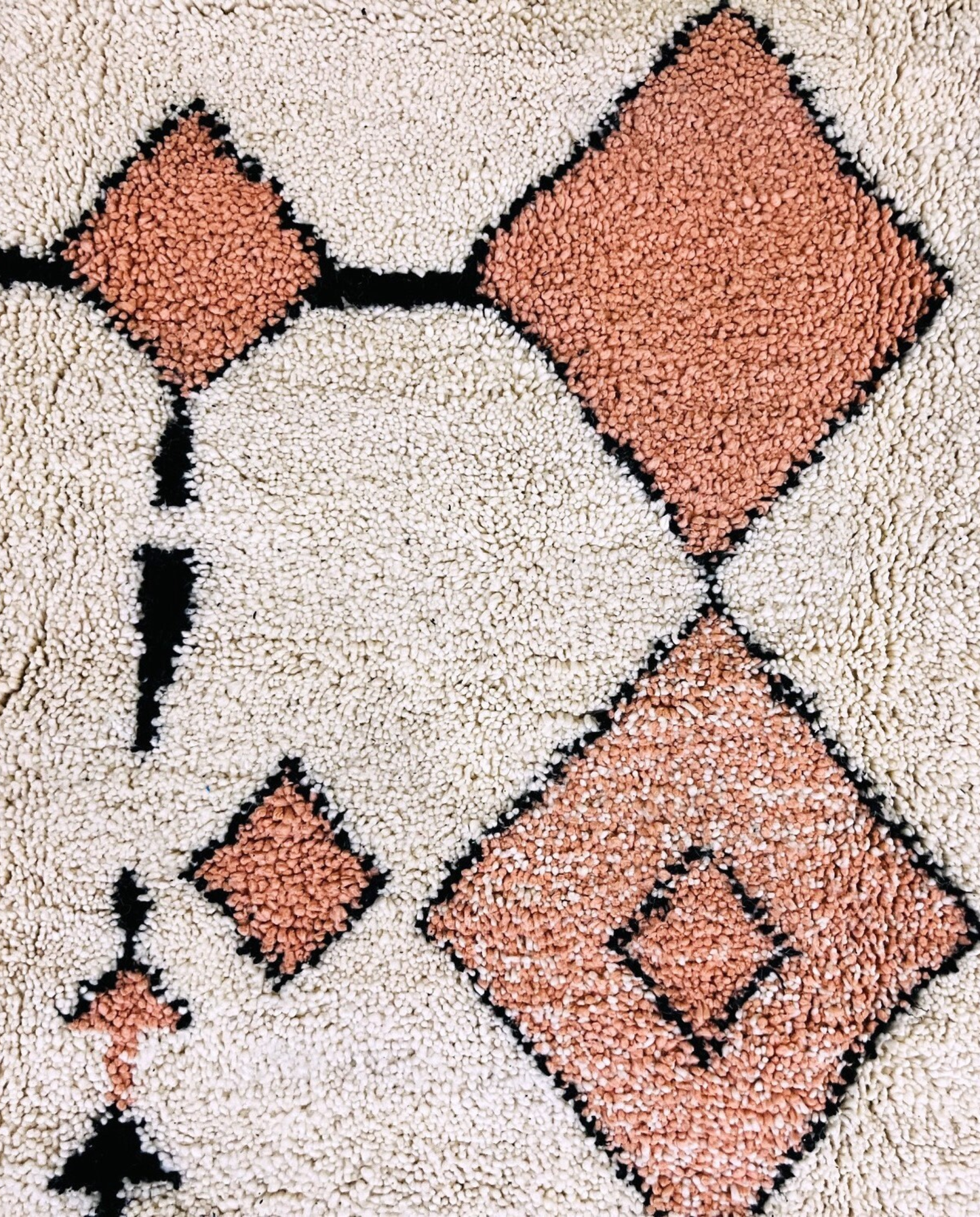 SOUHAILA Azilal cream scattered floating motifs Moroccan rug close-up showing hand-knotted wool texture and pile detail 1, by NURA