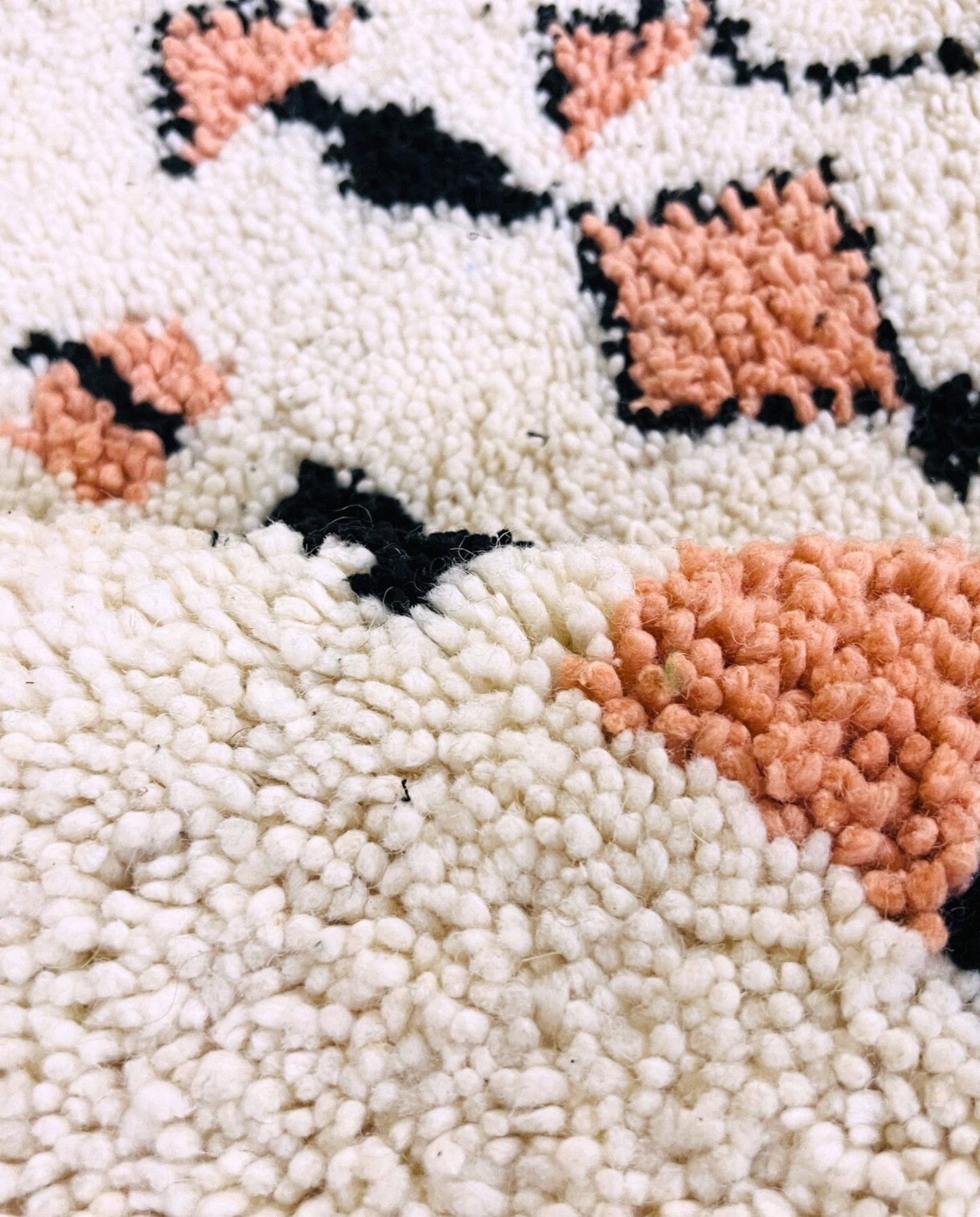 SOUHAILA Azilal cream scattered floating motifs Moroccan rug close-up showing hand-knotted wool texture and pile detail 2, by NURA