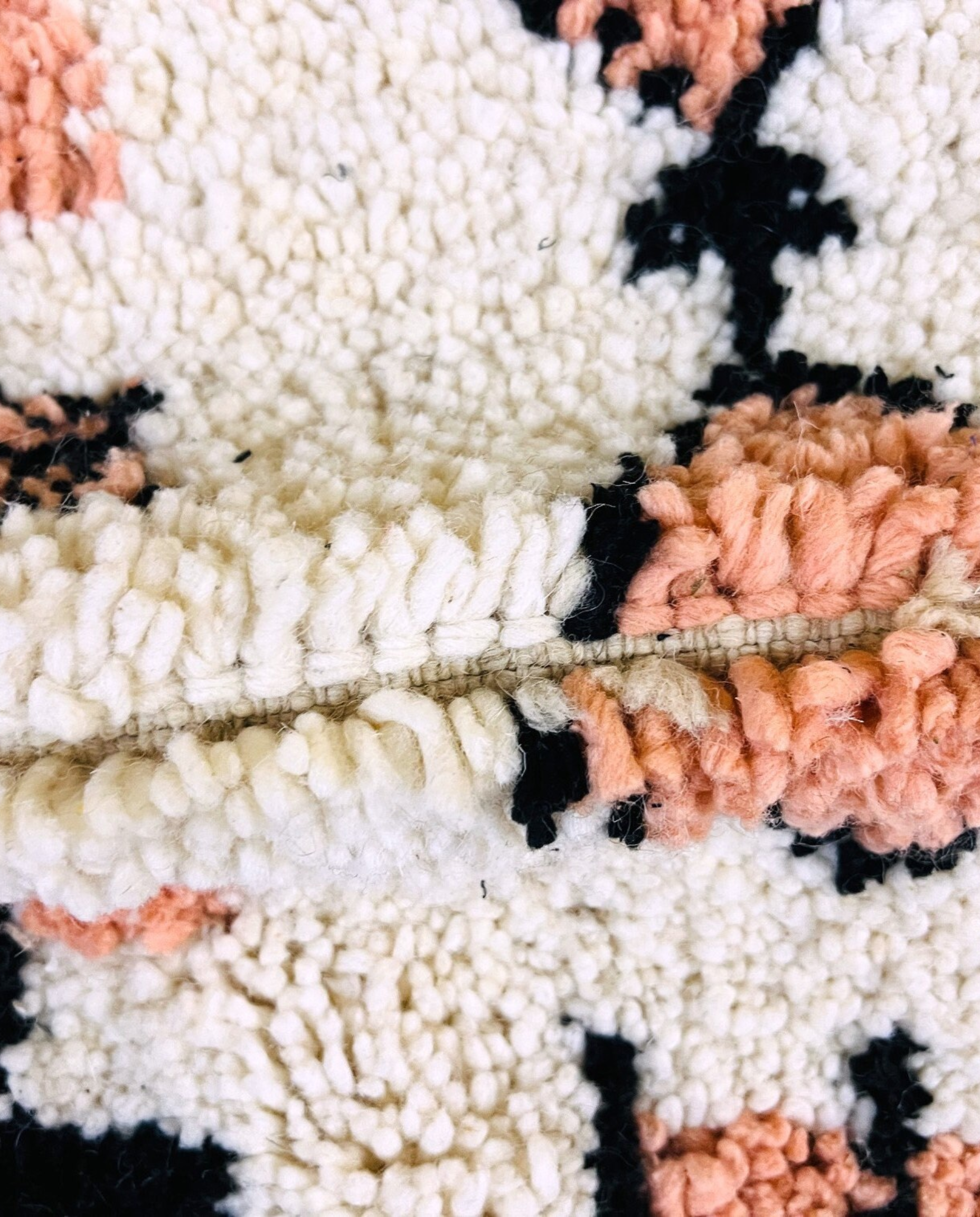 SOUHAILA Azilal cream scattered floating motifs Moroccan rug close-up showing hand-knotted wool texture and pile detail 3, by NURA