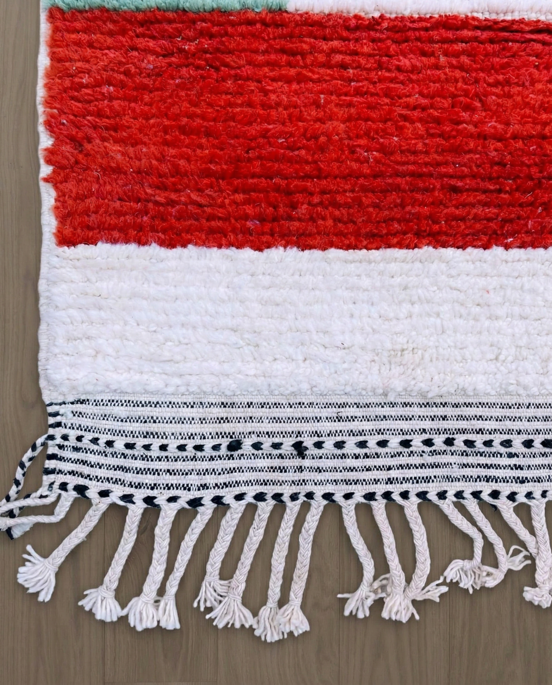 SOUKAINA Azilal cream abstract color block Moroccan rug close-up of hand-tied fringe and kilim band detail, by NURA