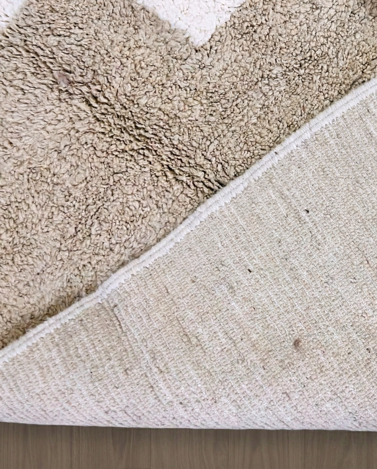 SOUMAYA Beni Ourain cream abstract stepped blocks Moroccan rug back view showing traditional handwoven construction, by NURA