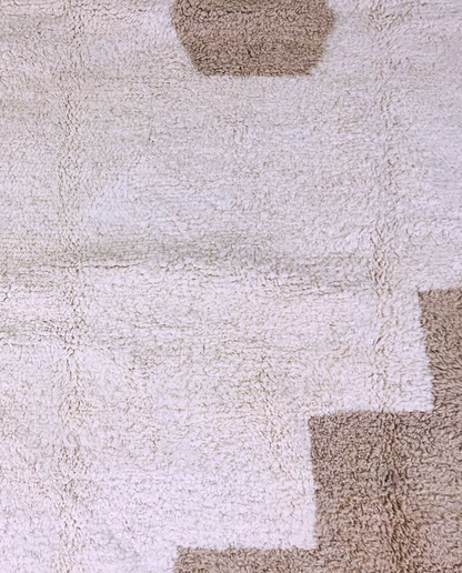 SOUMAYA Beni Ourain cream abstract stepped blocks Moroccan rug close-up showing hand-knotted wool texture and pile detail 1, by NURA