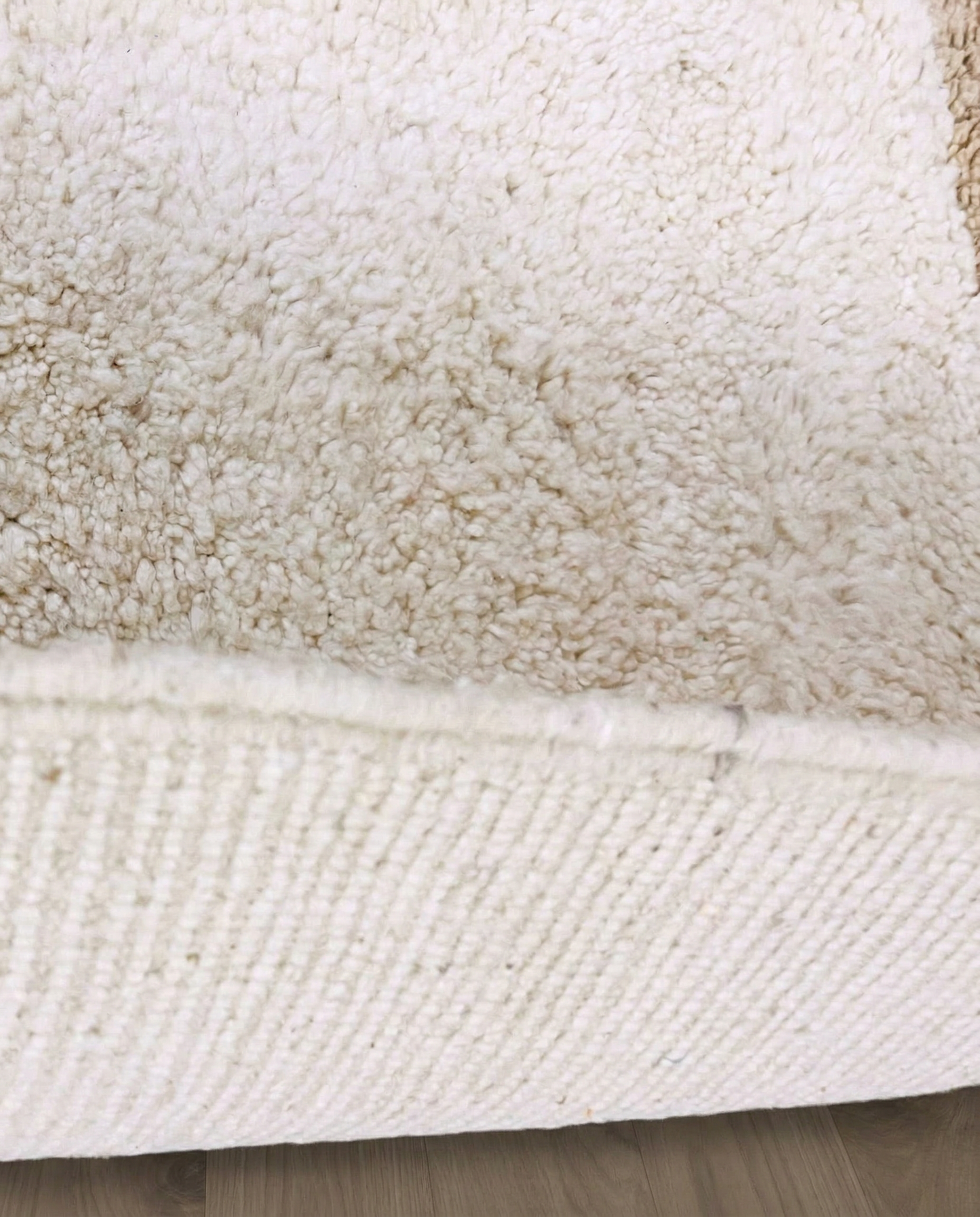SOUMAYA Beni Ourain cream abstract stepped blocks Moroccan rug close-up showing hand-knotted wool texture and pile detail 2, by NURA