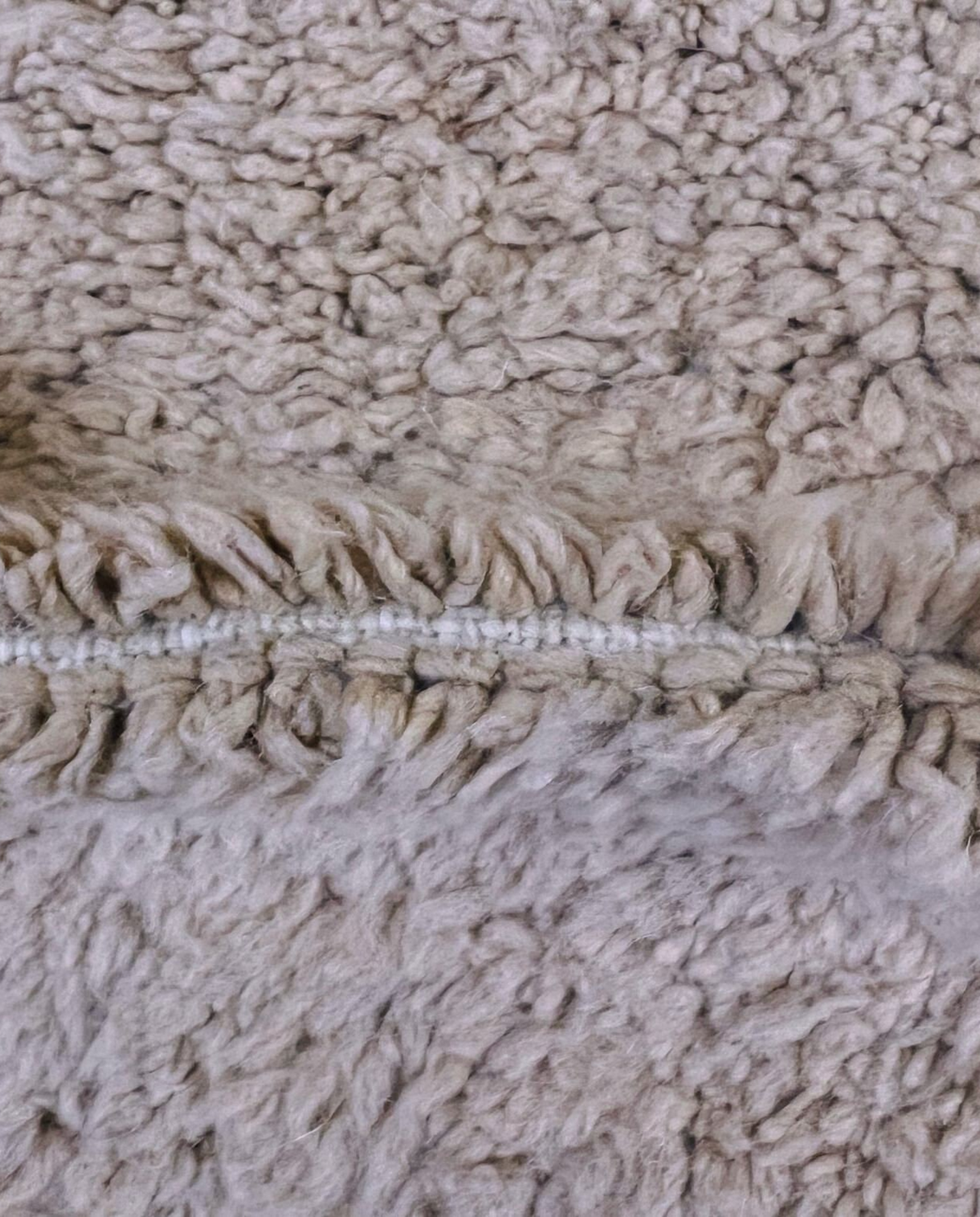 SOUMAYA Beni Ourain cream abstract stepped blocks Moroccan rug close-up showing hand-knotted wool texture and pile detail 3, by NURA