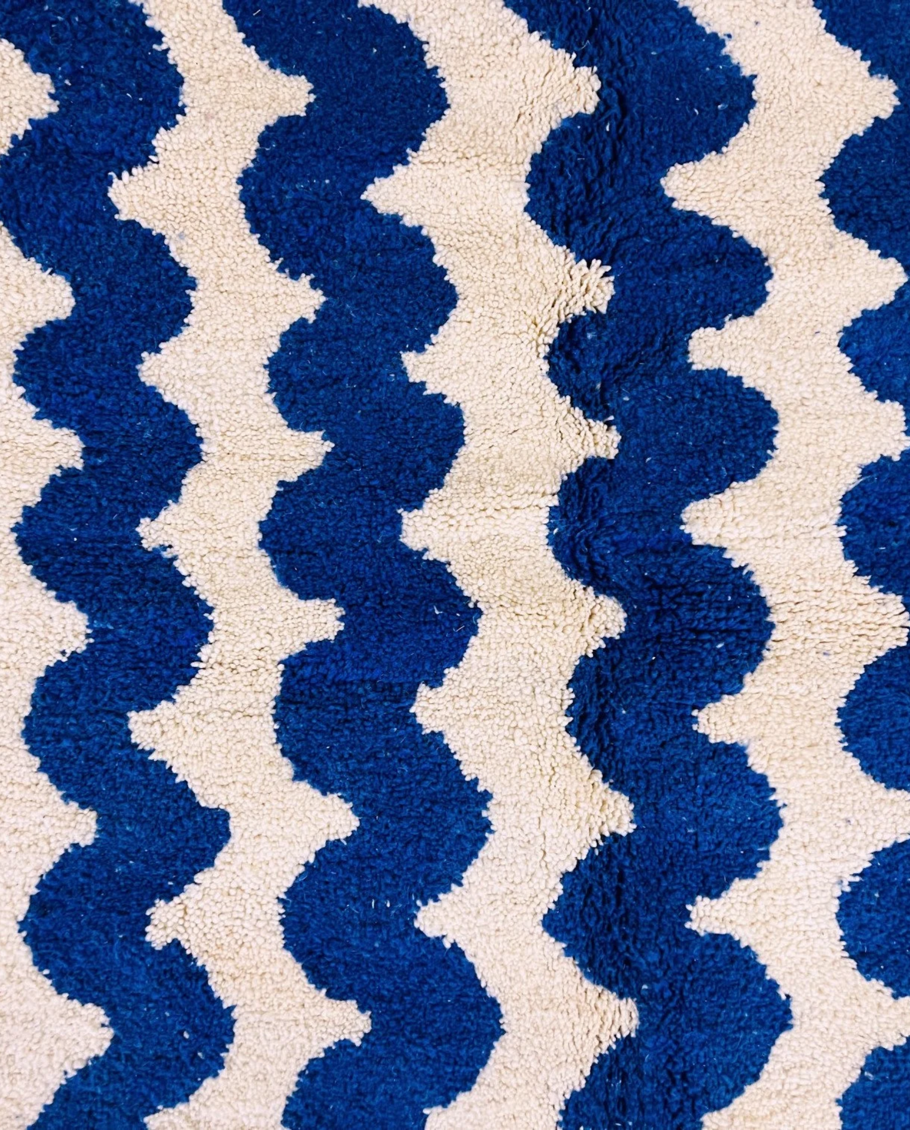 SOUMIA Beni Ourain cobalt wavy striped field Moroccan rug close-up showing hand-knotted wool texture and pile detail 1, by NURA