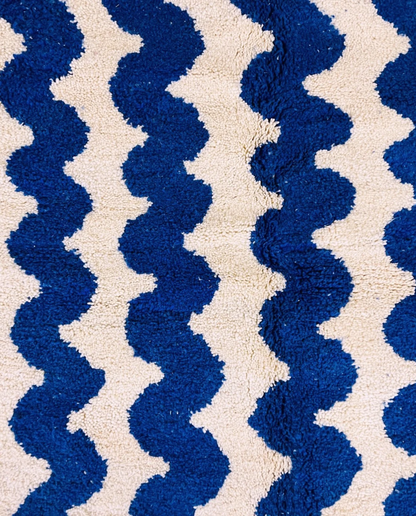 SOUMIA Beni Ourain cobalt wavy striped field Moroccan rug close-up showing hand-knotted wool texture and pile detail 1, by NURA