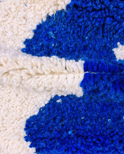 SOUMIA Beni Ourain cobalt wavy striped field Moroccan rug close-up showing hand-knotted wool texture and pile detail 3, by NURA