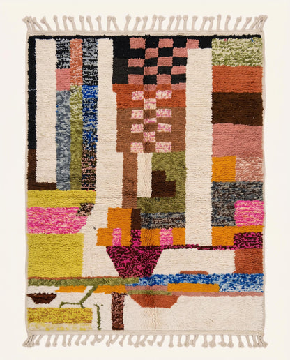 A vibrant Azilal Moroccan rug featuring abstract color blocks in pink, yellow, and orange on a plush cream wool pile, by NURA.