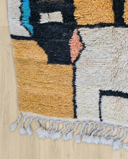 TALA Boujad mustard abstract color block Moroccan rug close-up of hand-tied fringe and kilim band detail, by NURA