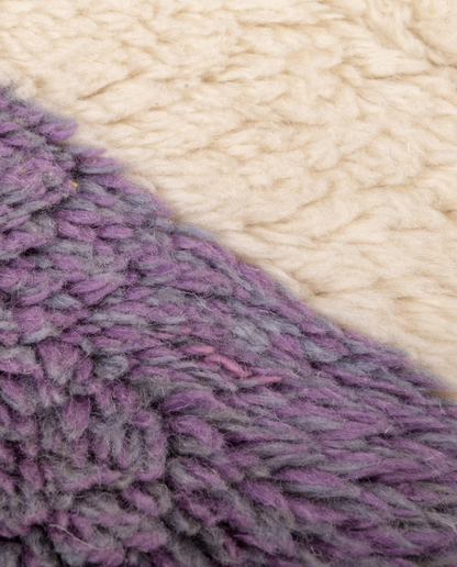 TALIA Boujad plum abstract hourglass motif Moroccan rug close-up showing hand-knotted wool texture and pile detail, by NURA