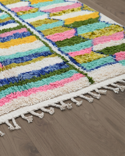 TASNIM Azilal cream checker grid Moroccan rug close-up of hand-tied fringe and kilim band detail, by NURA
