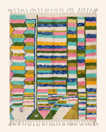 A vibrant colorful Azilal Moroccan rug by NURA featuring a playful checker grid of pink, blue, green, and yellow wool blocks.