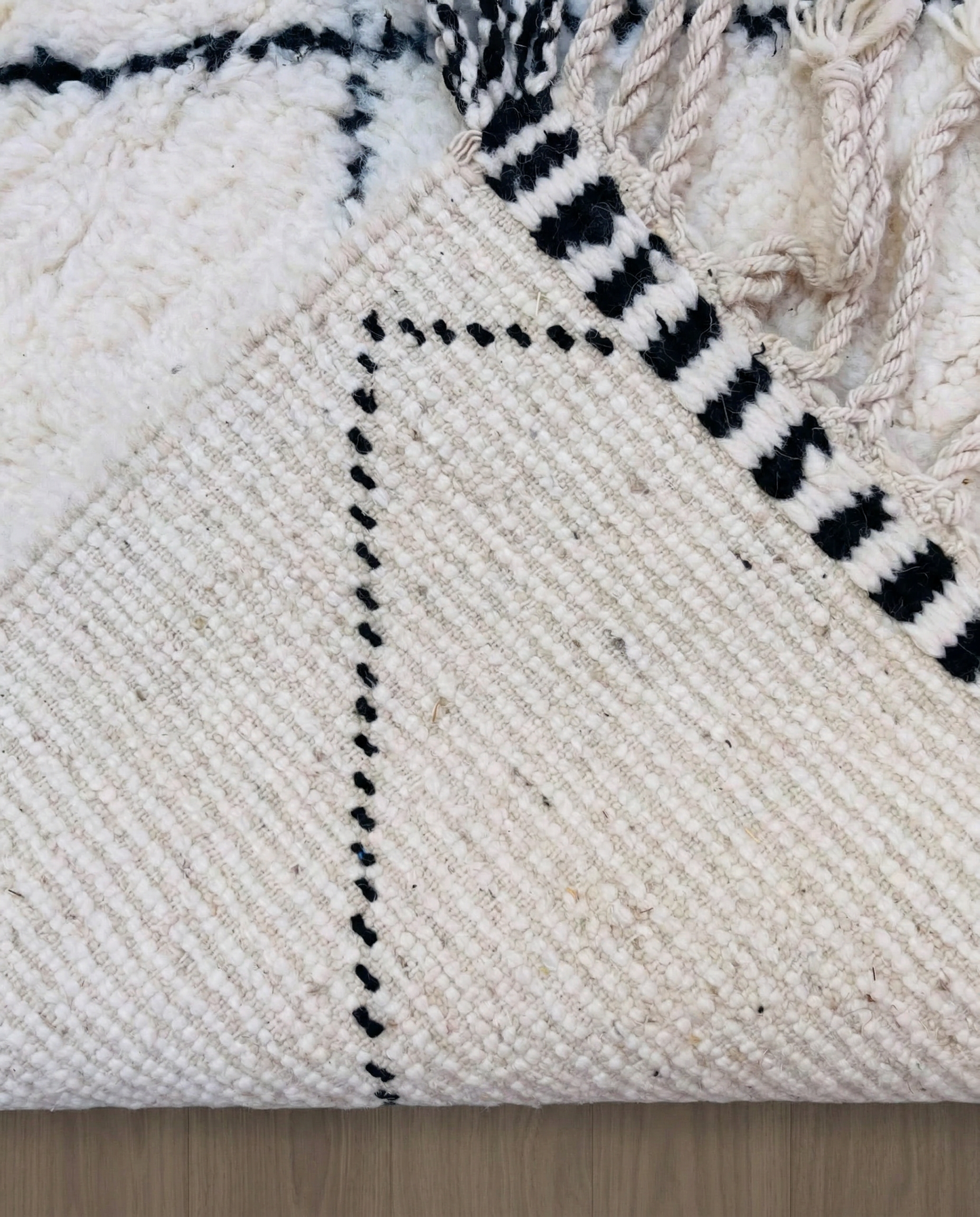 WAFAA Beni Ourain cream diamond lattice Moroccan rug back view showing traditional handwoven construction, by NURA