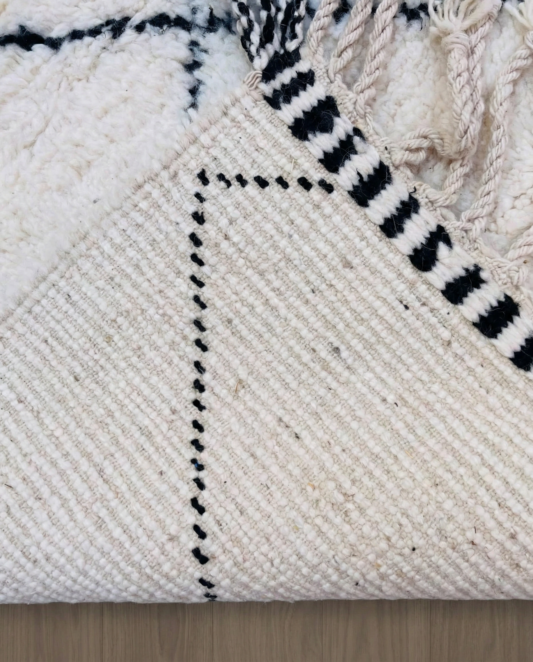 WAFAA Beni Ourain cream diamond lattice Moroccan rug back view showing traditional handwoven construction, by NURA