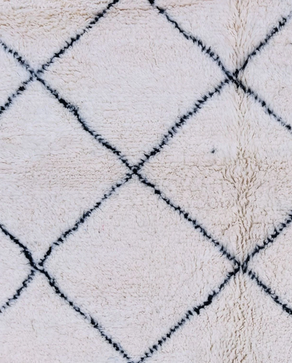 WAFAA Beni Ourain cream diamond lattice Moroccan rug close-up showing hand-knotted wool texture and pile detail 1, by NURA