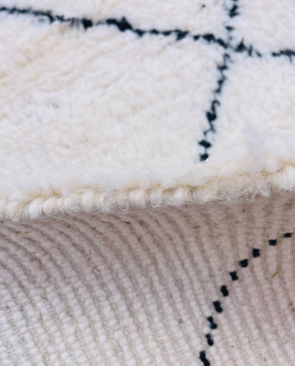 WAFAA Beni Ourain cream diamond lattice Moroccan rug close-up showing hand-knotted wool texture and pile detail 2, by NURA