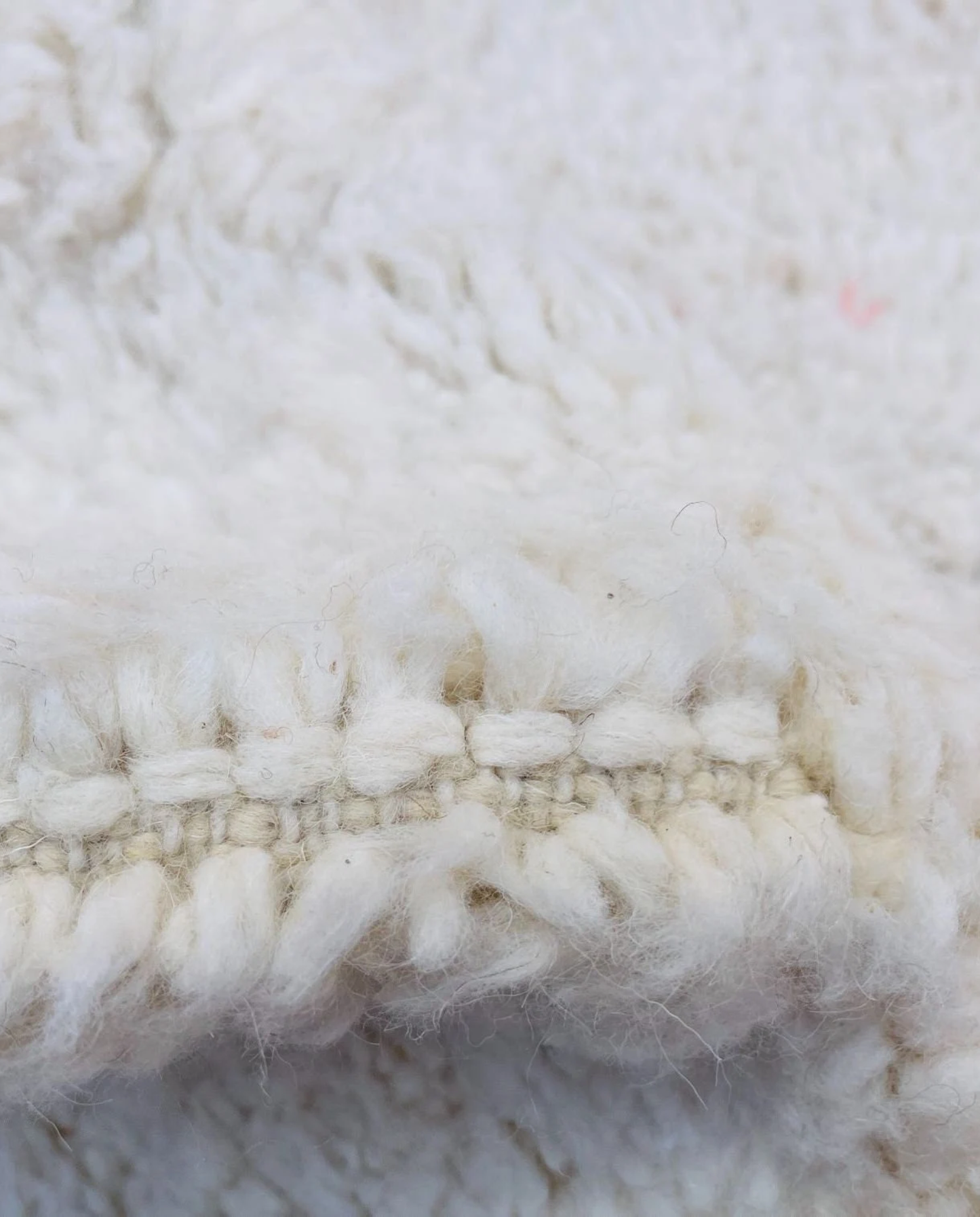 WAFAA Beni Ourain cream diamond lattice Moroccan rug close-up showing hand-knotted wool texture and pile detail 3, by NURA