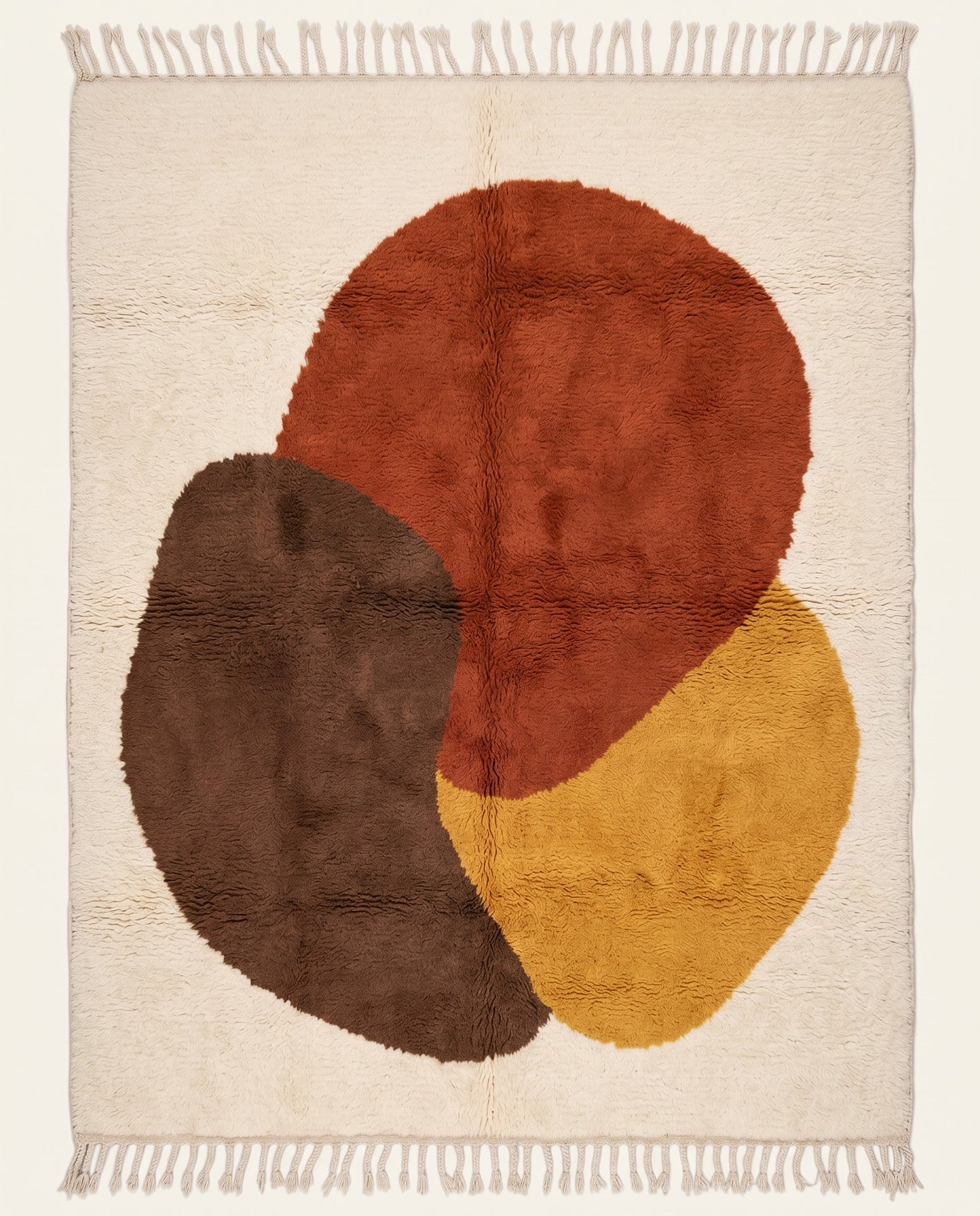 Plush Beni Ourain Moroccan rug by NURA featuring bold organic abstract shapes in rust, chocolate, and mustard on a cream field.