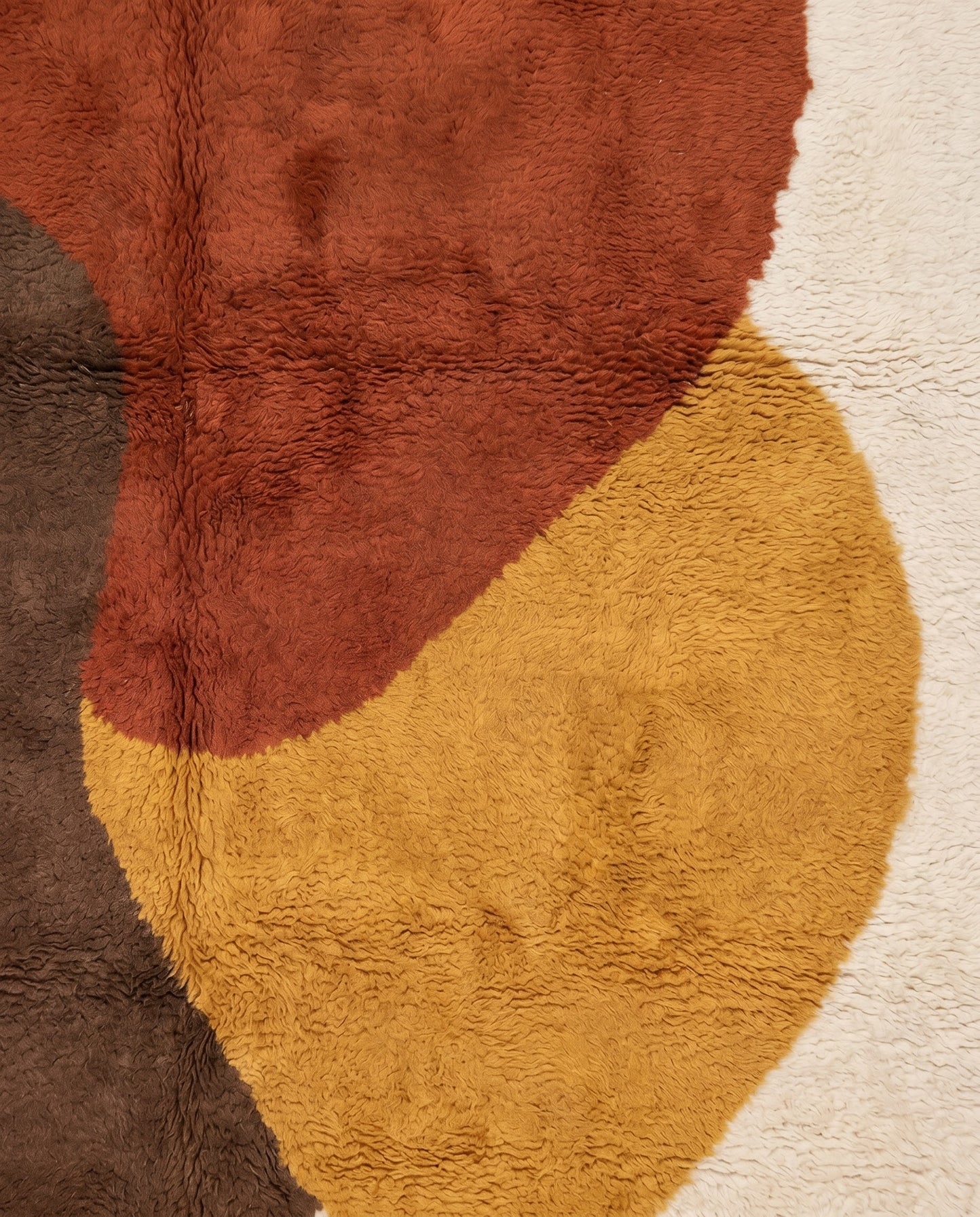 WIAM Beni Ourain cream organic abstract Moroccan rug close-up showing hand-knotted wool texture and pile detail, by NURA