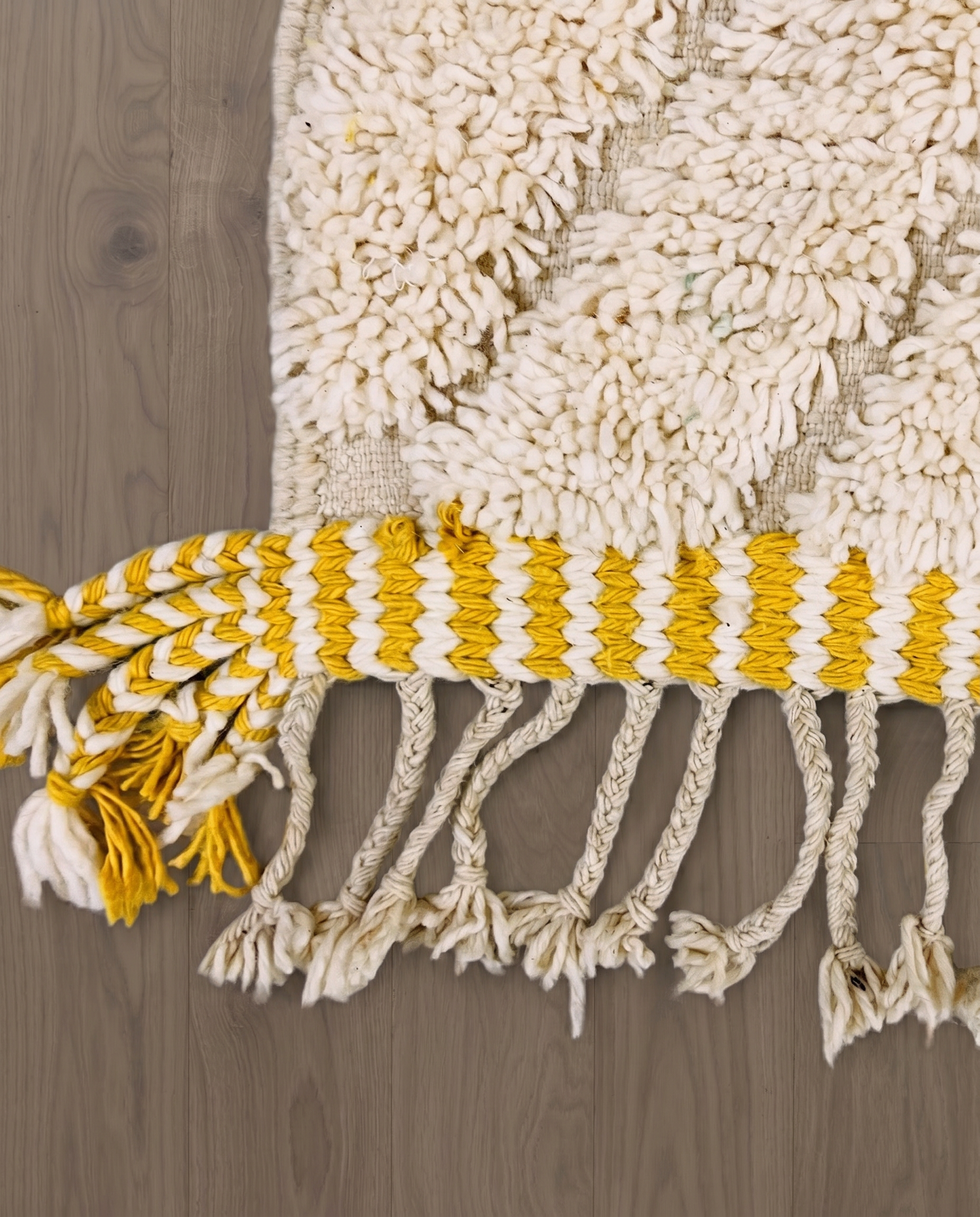 YARA Beni Ourain ivory bold diamond lattice Moroccan rug close-up of hand-tied fringe and kilim band detail, by NURA