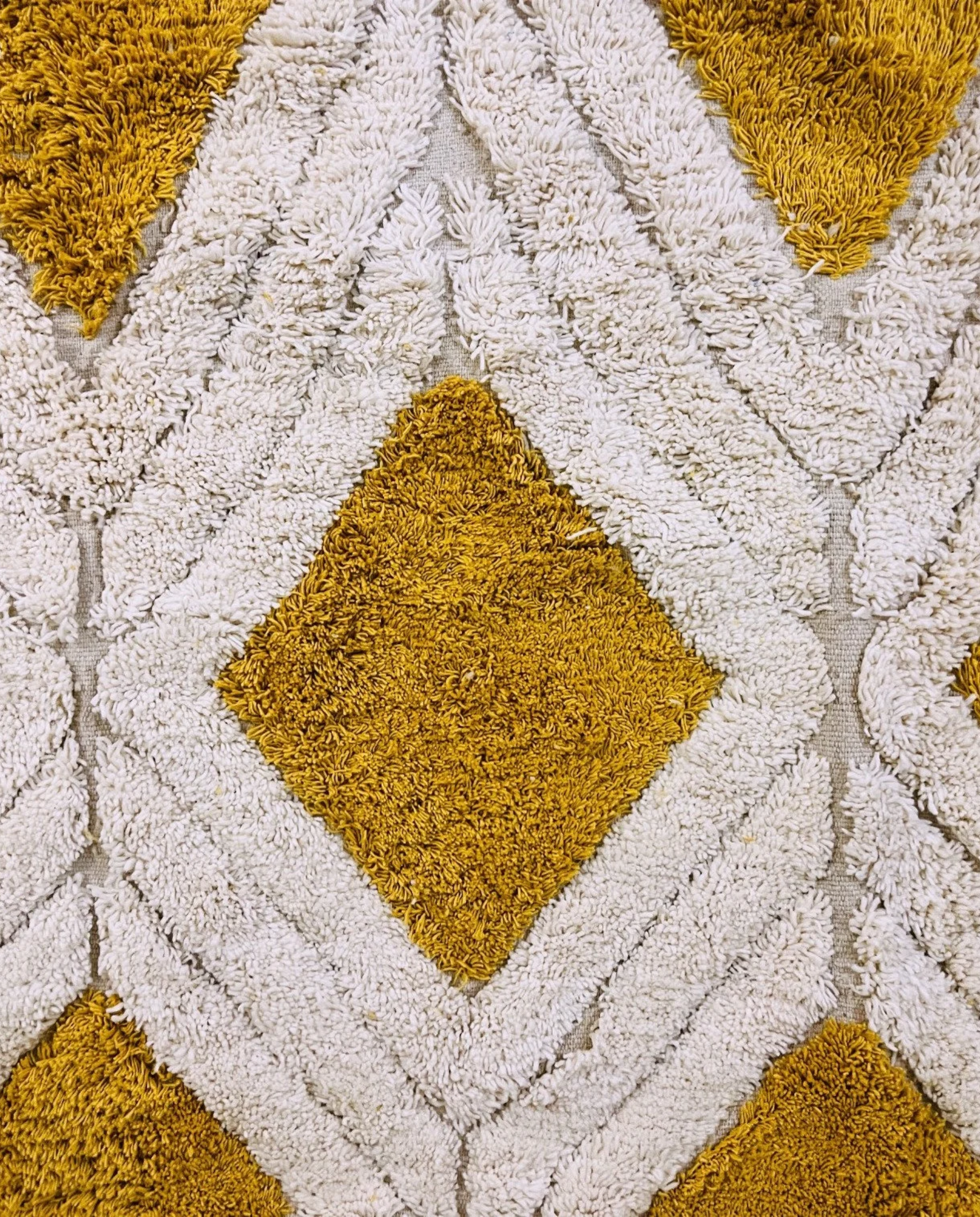 YARA Beni Ourain ivory bold diamond lattice Moroccan rug close-up showing hand-knotted wool texture and pile detail 1, by NURA