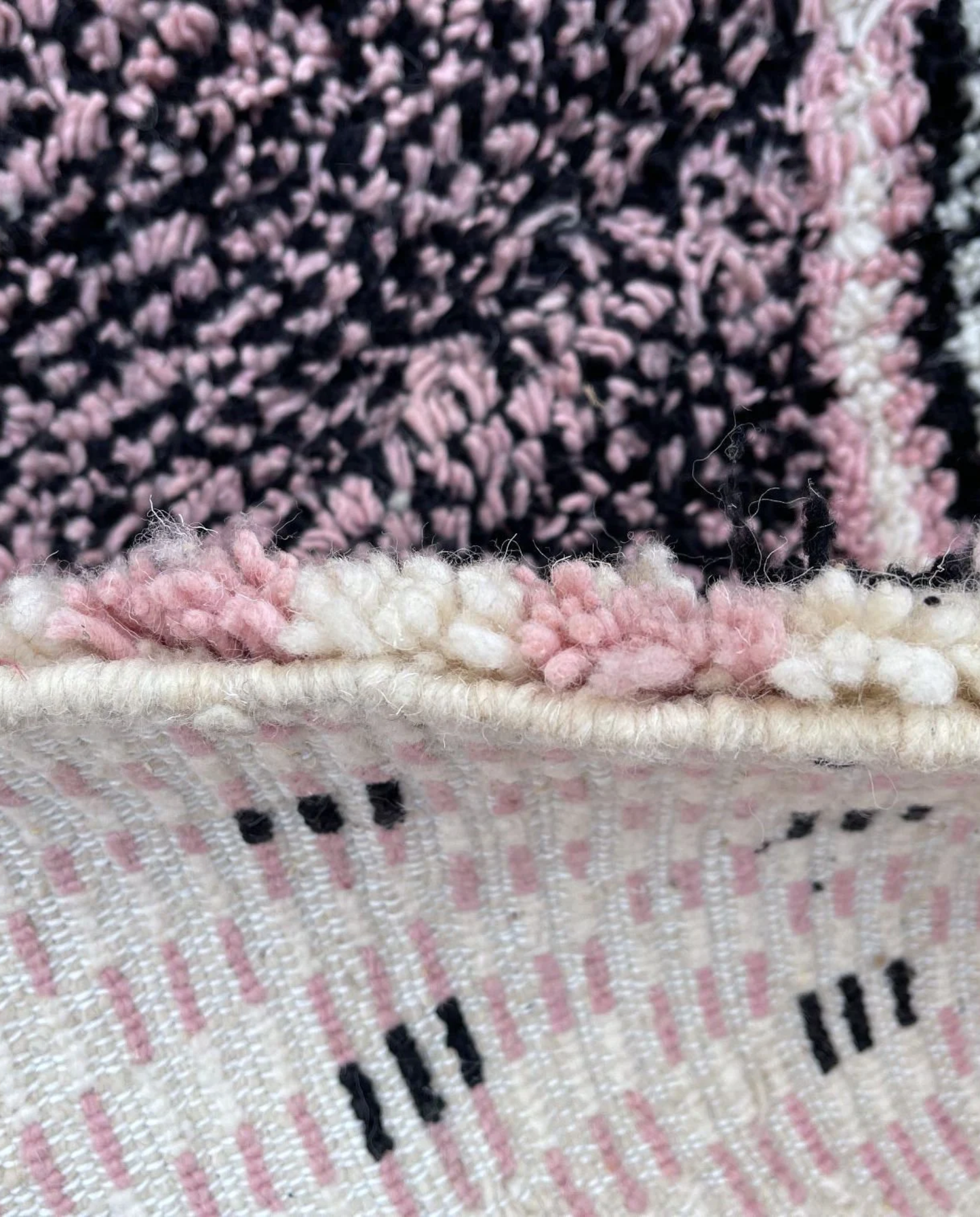 YOUSRA Azilal pink bold diamond lattice Moroccan rug close-up showing hand-knotted wool texture and pile detail 2, by NURA
