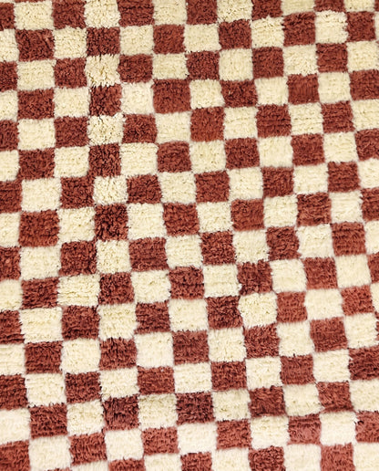 ZAHIA Beni Ourain terracotta checker grid Moroccan rug close-up showing hand-knotted wool texture and pile detail 1, by NURA