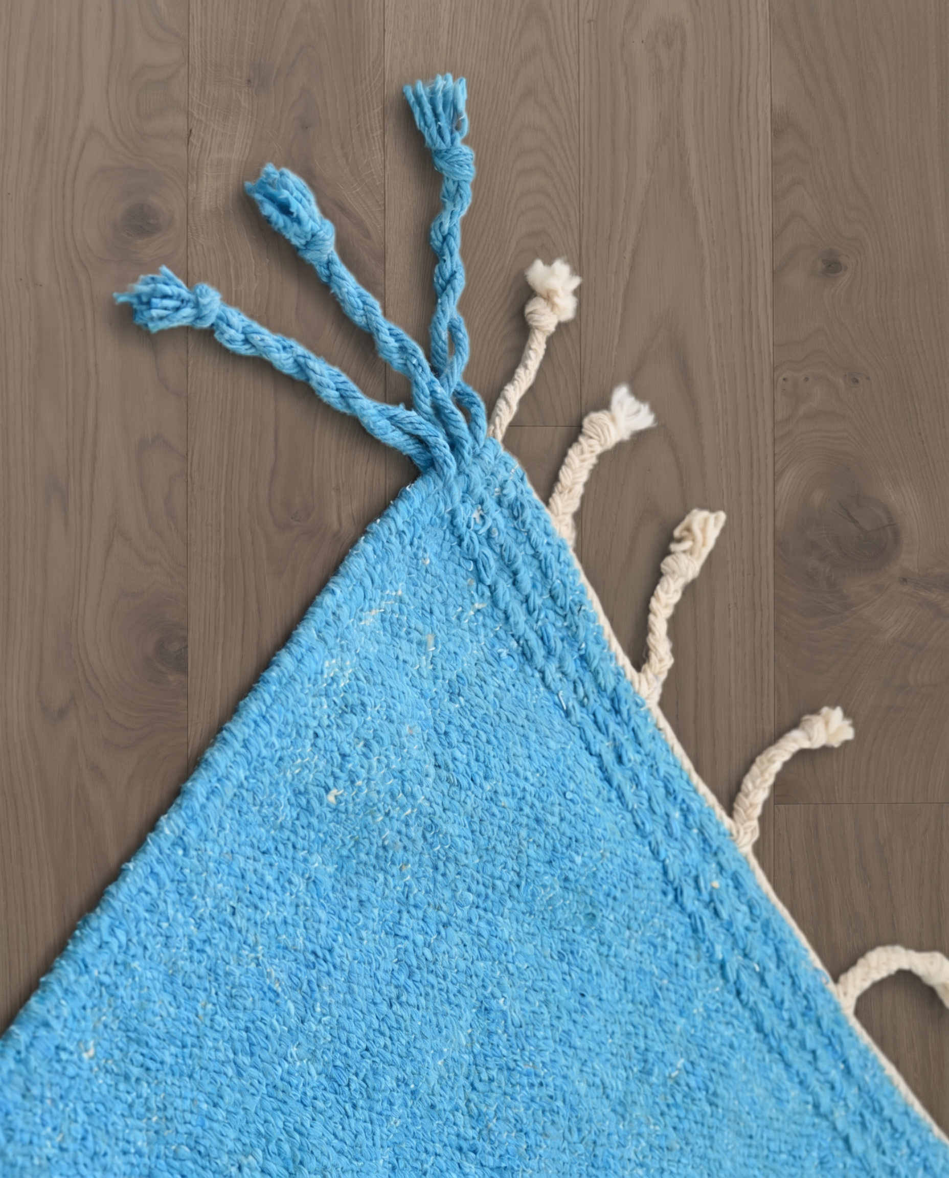 ZAYDA Azilal azure solid field Moroccan rug close-up of hand-tied fringe and kilim band detail, by NURA