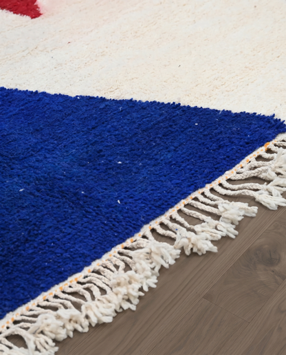 ZEGNA Azilal cream organic abstract Moroccan rug close-up of hand-tied fringe and kilim band detail, by NURA