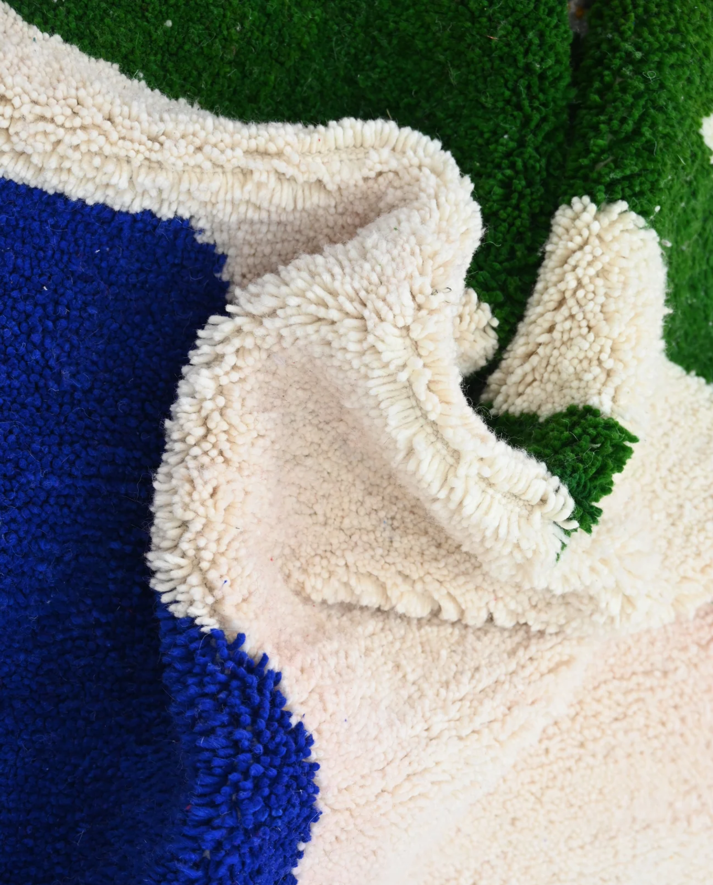 ZEGNA Azilal cream organic abstract Moroccan rug close-up showing hand-knotted wool texture and pile detail 2, by NURA