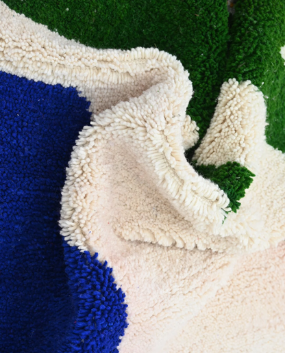 ZEGNA Azilal cream organic abstract Moroccan rug close-up showing hand-knotted wool texture and pile detail 2, by NURA