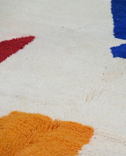 ZEGNA Azilal cream organic abstract Moroccan rug close-up showing hand-knotted wool texture and pile detail 3, by NURA