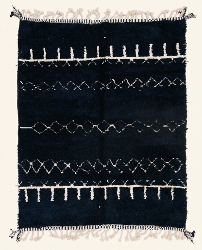 Plush black Beni Ourain Moroccan rug with horizontal white geometric bands and a thick pile, by NURA.