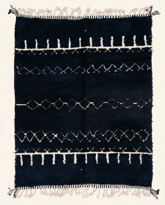 Plush black Beni Ourain Moroccan rug with horizontal white geometric bands and a thick pile, by NURA.
