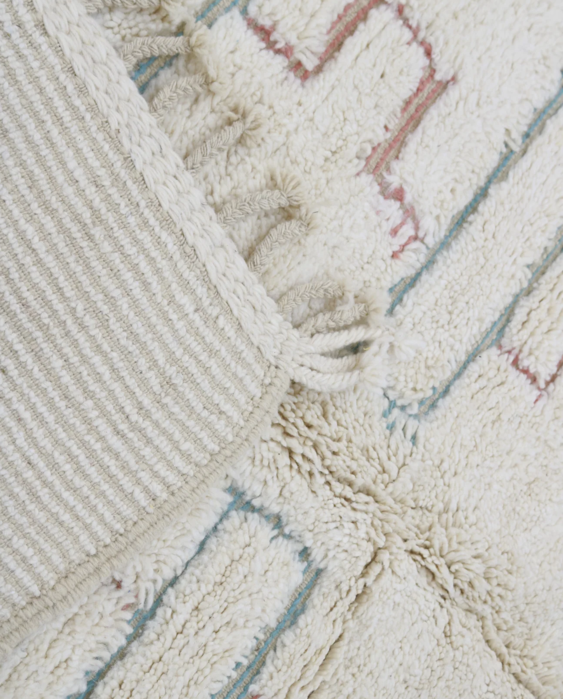 ZOUBIDA Beni Ourain cream floating forms Moroccan rug back view showing traditional handwoven construction, by NURA