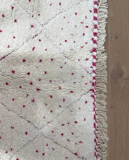 ZULEIKHA Beni Ourain cream dotted diamond lattice Moroccan rug close-up of hand-tied fringe and kilim band detail, by NURA