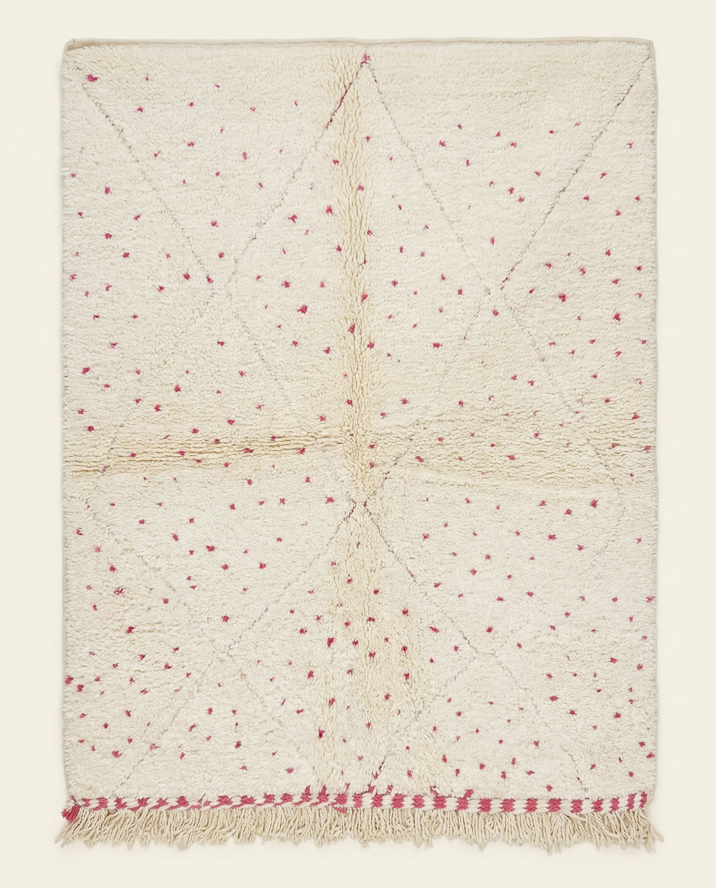 Plush cream Beni Ourain Moroccan rug with a subtle diamond lattice and scattered hot pink dots, by NURA.