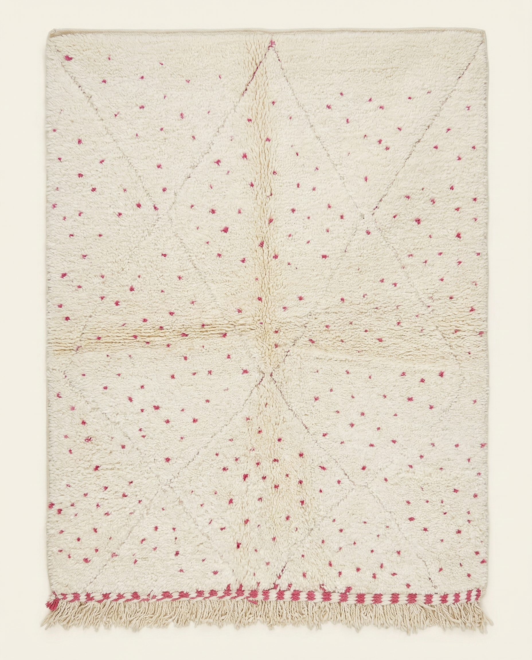 Plush cream Beni Ourain Moroccan rug with a subtle diamond lattice and scattered hot pink dots, by NURA.